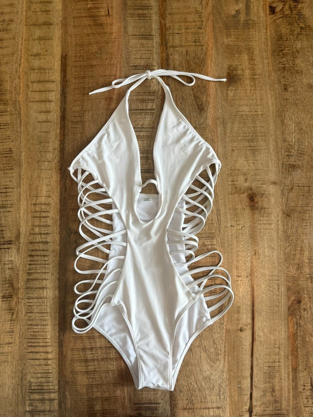 White one-piece monokini swimsuit plunging halter neckline and side cutouts